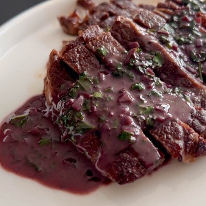 Rib eye in red wine sauce with mashed potatoes and red beets salad